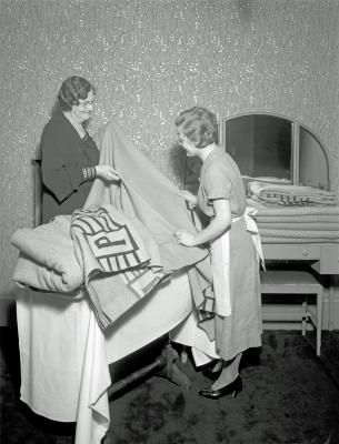 Two Women Holding Blankets