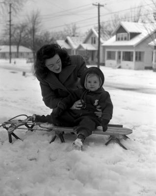 Mrs. William Snyder and daughter in snow