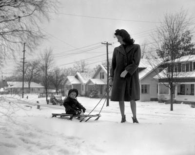 Mrs. William Snyder and daughter in snow