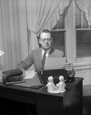 Backus, William at typewriter
