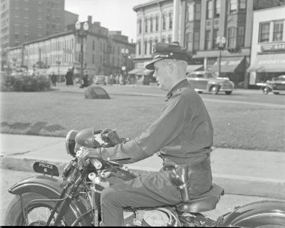 Motorcycle cop, on street